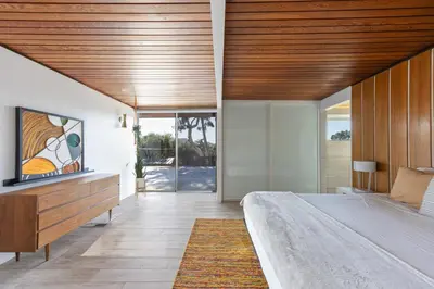 a bedroom with a large bed and a wooden ceiling at Mid-Century Masterpiece Tree house, Pool & Spa in Escondido
