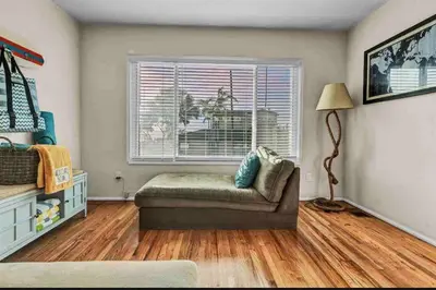 a living room with a couch and a window at Rustic Coastal Retreat in Sunset Cliffs three beds & two baths in San Diego