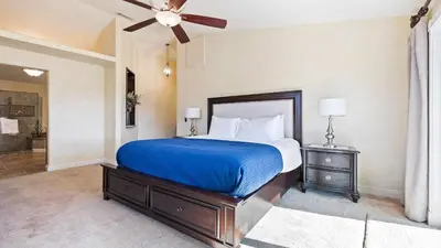 a bedroom with a bed and a ceiling fan at Chardonnay Charm by AvantStay Luxe Group Retreat w Pool Mins to Wineries in Country Road Estates