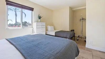 a bedroom with two beds and a window at Chardonnay Charm by AvantStay Luxe Group Retreat w Pool Mins to Wineries in Country Road Estates