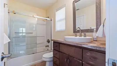 a bathroom with a sink and a toilet and a shower at Chardonnay Charm by AvantStay Luxe Group Retreat w Pool Mins to Wineries in Country Road Estates
