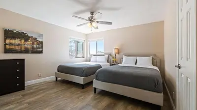 a bedroom with two beds and a ceiling fan at Chardonnay Charm by AvantStay Luxe Group Retreat w Pool Mins to Wineries in Country Road Estates