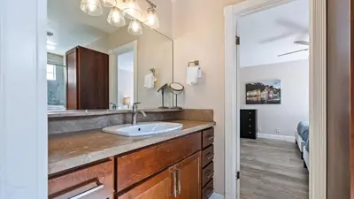 a bathroom with a sink and a mirror at Chardonnay Charm by AvantStay Luxe Group Retreat w Pool Mins to Wineries in Country Road Estates