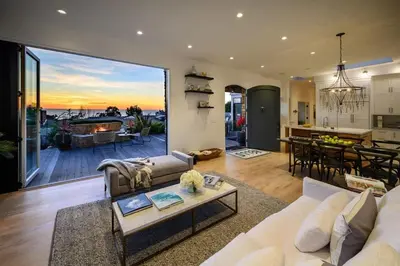 a living room with a couch and a table at 4BR Luxury Del Mar Beach House with Ocean Views in San Diego
