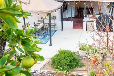 a patio with a table and a tent at SanDiego Insider's Coastal Bliss and Urban Wonders in San Diego
