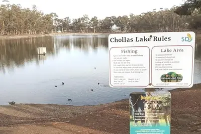 a lake with a sign in front of it at SanDiego Insider's Coastal Bliss and Urban Wonders in San Diego