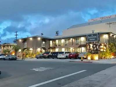 a large building with cars parked in front of it at Berkshire Motor Hotel in San Diego