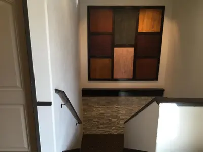 a bathroom with a painting on the wall at Berkshire Motor Hotel in San Diego