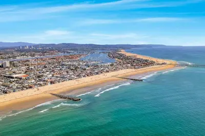 an aerial view of a beach and the ocean at Walk To The Waves Newport Beach House in Newport Beach