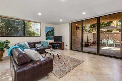 a living room with a couch and a table at La Jolla Gem condo in San Diego