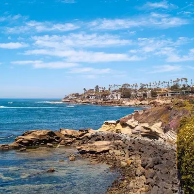 a view of a beach with the ocean and buildings at La Jolla Gem condo in San Diego