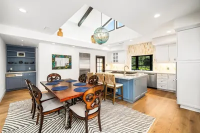 a kitchen with a dining room table and chairs at Grand Mediterranean Villa in La Jolla Hillside in San Diego