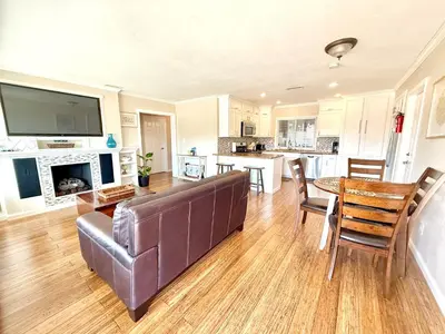a living room with a couch and a table at The Cozy Ranch Retreat in San Diego
