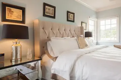 a bedroom with a large white bed and a window at Luxurious Family 5 Bedroom Getaway in San Diego