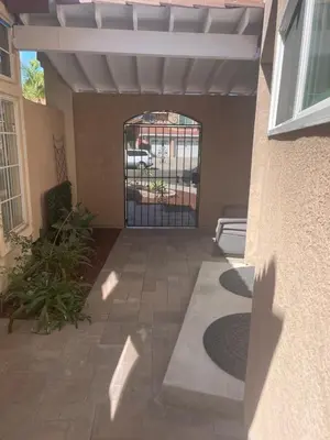 an open gate to a building with a patio at Casa Mesa in San Diego