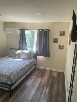 a bedroom with a bed and a window at Casa Mesa in San Diego