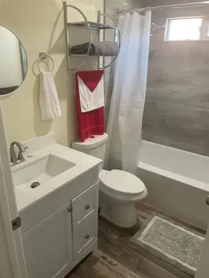 a bathroom with a toilet and a sink and a shower at Casa Mesa in San Diego