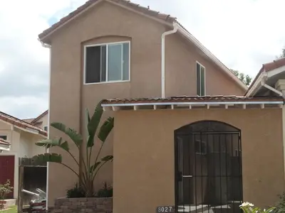 a house with a gate in the front of it at Casa Mesa in San Diego