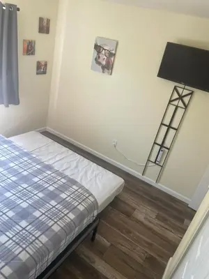 a bedroom with a bed and a ladder on the wall at Casa Mesa in San Diego