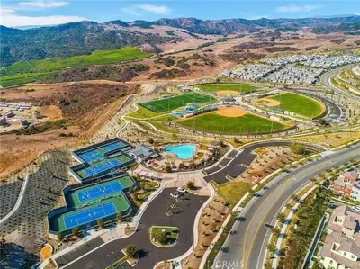 an aerial view of a city with buildings and a road at Dreamy Bloom Enclave Irivne LA RMV in American Display Heliport