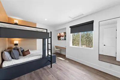 a bedroom with a bunk bed and a desk at Vaquero by Fieldtrip Modern Wine Country Resort in Temecula