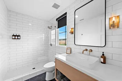 a white bathroom with a sink and a toilet at Vaquero by Fieldtrip Modern Wine Country Resort in Temecula