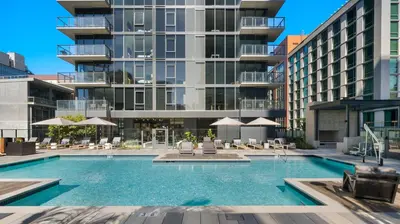a swimming pool in front of a building at Kasa Little Italy San Diego in San Diego