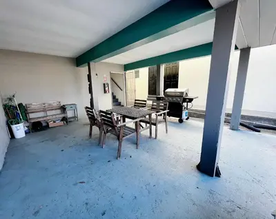 a patio with a table and chairs in a building at Charming Ocean Beach 2BR in San Diego