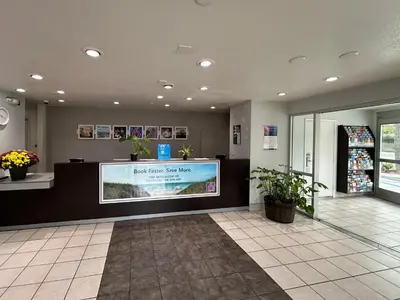a lobby of a store with a large screen at Studio 6 San Diego, CA Hotel Circle Mission Valley in San Diego