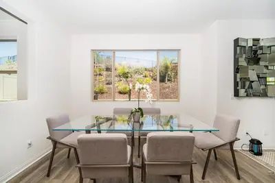 a dining room with a glass table and chairs at Allura Champagne New in Wine Country Pool Game Room in Country Road Estates