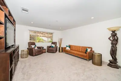 a living room with couches and a flat screen tv at Allura Champagne New in Wine Country Pool Game Room in Country Road Estates