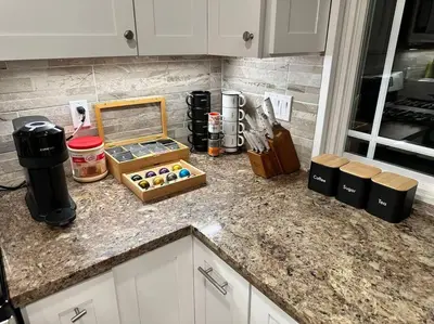 a kitchen counter with a box of donuts on it at Anselmo in Mission Viejo