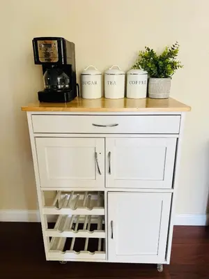 a white cabinet with three cups and a coffee maker at Calligraphy home with Private Deck near SDSU in San Diego