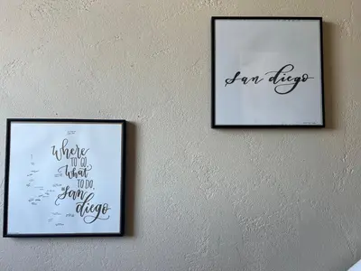 two pictures on a wall with writing on it at Calligraphy home with Private Deck near SDSU in San Diego