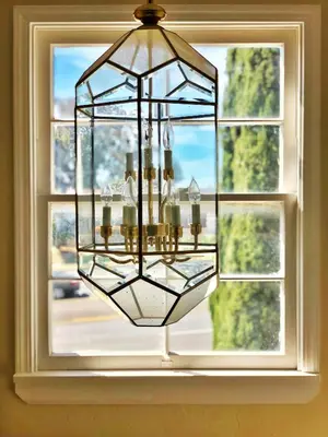 a chandelier hanging in front of a window at Calligraphy home with Private Deck near SDSU in San Diego