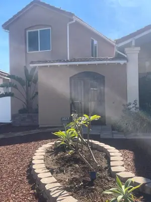 a house with a plant in the front yard at Casa Mesa PLUS attached Studio & private Courtyard in San Diego
