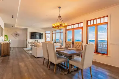 a dining room with a table and chairs at Spectacular La Jolla Cove Compound in San Diego