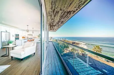 a living room with a view of the ocean at Spectacular La Jolla Cove Compound in San Diego