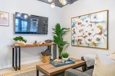 a living room with a couch and a table at Gorgeous Villa Steps to La Jolla Cove in San Diego