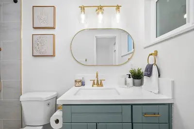 a bathroom with a sink and a mirror at NEW CA Coastal Beauty 6 mins to Imperial Beach in San Diego