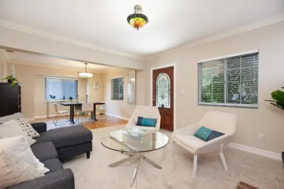 a living room with a couch and chairs and a table at Hillcrest 3 bedroom charming private home by shops & restaurants in San Diego