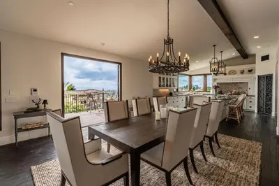a kitchen and dining room with a table and chairs at Spanish Dream with Ocean Views in Encinitas