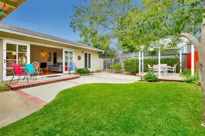 a home with a patio and a yard at PuertAzul in San Diego