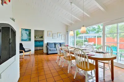 a dining room with a table and chairs at PuertAzul in San Diego