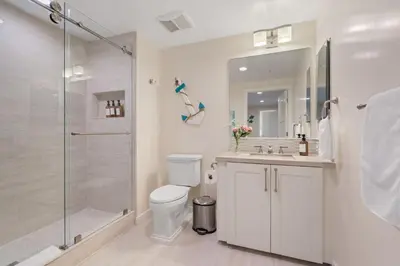 a bathroom with a shower and a toilet and a sink at Blissful Retreat in San Diego
