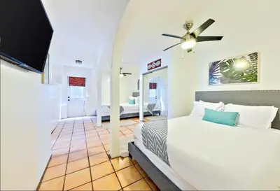 a bedroom with a bed and a ceiling fan at Coastal Overlook in San Diego