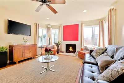 a living room with a couch and a fire place at Sandy Shores Beach House in San Diego