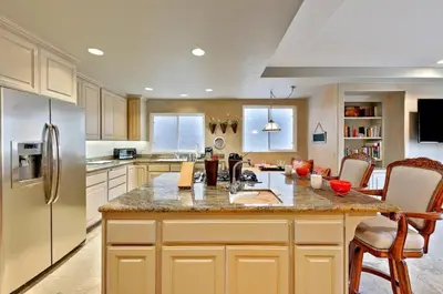a kitchen with a large island in the middle at Village and Views in San Diego