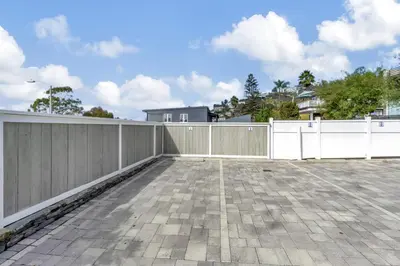 a fence on a patio with a fence at Ocean Views! Detached Villa by Victoria Beach in Laguna Beach