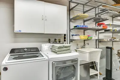 a kitchen with a washing machine and a sink at 13 Mi to Downtown San Diego Quiet Home with Spa! in Chula Vista